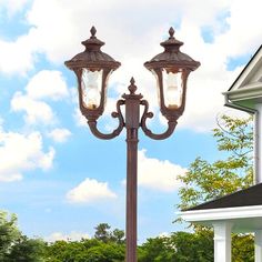 a lamp post in front of a house