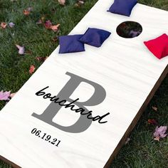 a personalized cornhole board on the grass