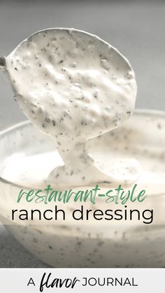 a spoon full of ranch dressing in a bowl