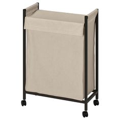 a laundry hamper on wheels with a beige cover over the top and black frame