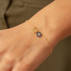 "This beautiful 14K Gold bracelet has an evil eye charm and a heart charm with a 14K gold chain. Dainty Evil Eye with Heart Charm Protection Bracelet is a Great Gift For Her. We ship our products by Express shipping free to the USA, Europe, the UK and most of the world. Most of our shipment to the USA, Europe and the UK has been delivered in 2 days. In general, it takes 2-5 business days to deliver all around the world. . Material: Solid real Gold (not gold filled or gold plated) Gold Karat: 14k Blue Heart Charm Bracelet As A Gift, Blue Heart Charm Bracelet For Gift, Heart-shaped Blue Charm Bracelet For Gift, Blue Heart Charm Bracelet Gift, Gold Evil Eye Bracelet With Charms For Gift, Gold Evil Eye Bracelet With Charms As Gift, Gold Heart-shaped Evil Eye Jewelry, Heart-shaped Gold Evil Eye Jewelry, Gold Heart Evil Eye Jewelry