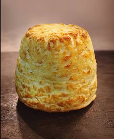 a baked pastry sitting on top of a wooden table