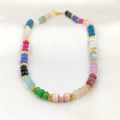 Description Details.... Multi Color Beaded Necklace - Rainbow Color Rondelle Bead Necklace - Colorful Smooth Gemstone Necklace - Beachy Necklace - Selling Per Piece Gemstone : Multi Gemstone  Metal : Brass Plating : Gold Plated Stone Shape : Rondelle Stone Size : 7-8mm Necklace Size : 16 Inch + 2 Inch Extension SKU : GDPEN - 484 Being a manufacturer we can do this type of gemstone necklace in other stone color, shape and size..Welcome for customize designs. In order to fulfill the special demand Bohemian Rainbow Crystal Necklaces With Faceted Beads, Bohemian Rainbow Crystal Necklace With Faceted Beads, Rainbow Beaded Necklaces With Natural Stones, Multicolor Round Bead Crystal Necklaces For Beach, Multicolor Rondelle Beaded Necklaces With Natural Stones, Handmade Multicolor Rondelle Crystal Necklaces, Handmade Multicolor Rondelle Necklaces, Spiritual Multicolor Rondelle Beaded Necklaces, Multicolor Beaded Necklaces With Natural Stones For Beach