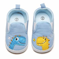 Baby Girls Dinosaur Slip On Canvas Sneakers - PrettyKid Blue Non-slip Round Toe Booties, Blue Non-slip Booties For Playtime, Casual Blue Booties For Playtime, Playful Summer Sneakers For Playtime, Casual Blue Booties With Soft Sole, Cute Low-top Booties For Playtime, Casual Spring Booties For Playtime, Casual Spring Booties For Outdoor Play, Cute Blue Non-slip Sneakers