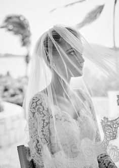 black and white photograph of a woman wearing a veil