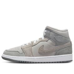 Step into the Air Jordan 1 Mid SE Particle Grey for an unforgettable classic. This sneaker is crafted with supple suede throughout its upper, featuring a grey nubuck and fluffy suede overlays. Its inner lining is made of white fleece that adds comfort to your steps. The sneaker is finished off with a White midsole and Grey outsole, completing a timeless design that you'll love for years to come. (AJ1/SNKR/Retro/Mid Top/Women's/Basketball) Wmns Air Jordan 1, Grey Jordans, Air Jordan 1 Mid Se, White Fleece, Women's Basketball, Mid Top, Air Jordan 1 Mid, Womens Basketball, Jordan 1 Mid