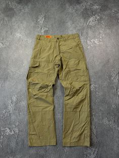 Please read and ask before buying this item. This is used clothing! Look all pics.  Make sure that suits you👌  ---------------------------- Fjallraven Men's Khaki Karl MT Trousers Cargo Pants Hiking Outdoor Size: 48 (Seen Measurements) Condition: 9/10 (Seen all photos.)  Ask more questions  OFFERS 👋  Follow me ✅  ----------------------------  ❗️Many buyers without reading the description later ask questions:  Why didn't I receive the item or where is it?  Delivery usually arrives 14/20/30/45 days after purchase. But there are delays due to what?  Due to holidays, weather conditions, customs checks, etc. Khaki Hunting Pants With Pockets, Utility Hunting Bottoms With Pockets, Cargo Pants Styling, Cargo Pants Style, Mens Khakis, Outdoor Hiking, Used Clothing, Mens Trousers, Plein Air