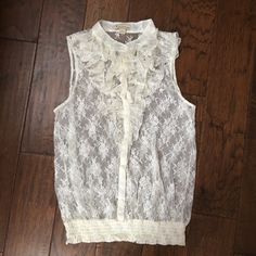 Nwot Forever 21 Sheer Lace Top - Size: L - Color: Ivory - Never Worn - Sleeveless Button-Down Style With Elastic Band At Waist - Ruffled Lace At The Neckline - Please Note, Something Must Be Worn Under This, As It Is Sheer! Forever 21 White Sleeveless Top, Forever 21 White Blouse For Spring, Forever 21 White Ruffled Top, Forever 21 White Tops With Ruffles, Forever 21 White Feminine Top, Sheer Lace Top, Color Ivory, Sheer Lace, Forever 21 Tops