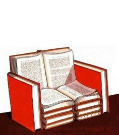 an open book sitting on top of a red chair next to a pile of books