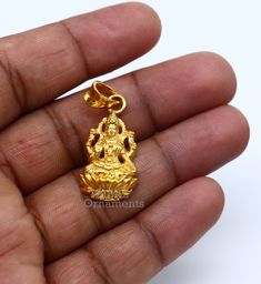 925 sterling silver handmade custom design vintage antique style Indian Hindu Goddess Laxmi pendant, this is special leaf Ganesh design pendant, best wishes blessing gift for your special person, excellent jewelry from India. Metal-925 sterling silver. Item type-Pendant. Length-3.8 centimeters. Width-1.5 centimeters. Weight-4.250 grams. Stamped-925. Finish-Gold polished over 925 silver Make excellent gifting and collectible pieces(gift for birthday, wedding, anniversary, mother's day, fathers da Laxmi Gold Pendant, Yellow Gold Jewelry For Festivals, Engraved Brass Temple Jewelry, Temple Jewelry Engraved Round Pendant, Gold Plated Jewelry For Diwali Gift, Brass Temple Jewelry As Gift, Diwali Gift Brass Jewelry, Spiritual 22k Gold Round Pendant Jewelry, 22k Gold Spiritual Round Pendant