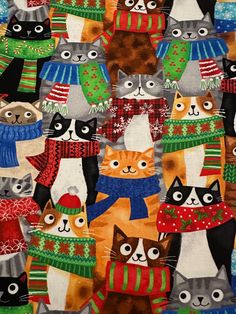 a group of cats wearing sweaters and scarves on a colorful background with snowflakes