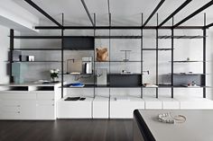 a white room with shelves and drawers in it