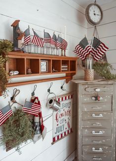 an old dresser is decorated with patriotic decorations