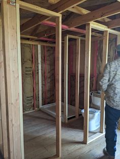 a man standing inside of a room under construction