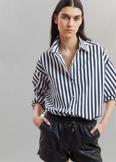 Sylvia Striped Oxford Shirt - Faded Black/White Shirt The Frankie Shop Classic Shirt With Roll-up Sleeves For Day Out, Chic Cotton Blouse With Spread Collar, Chic Shirt For Daywear With Relaxed Fit, Oversized Blouse With Roll-up Sleeves And Spread Collar, Chic Relaxed Fit Shirt For Daywear, Chic White Blouse With Roll-up Sleeves, Chic Blouse With Rolled Sleeves For Daywear, Spring Daywear Blouse With Roll-up Sleeves, Classic Shirt With Rolled Sleeves For Day Out