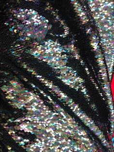 Reversible Flip Up Sequins Experience the magic of two-tone reversible sequins with our Flip Up Sequins Fabric. This stunning fabric features multi-color sequins that can be flipped up to reveal a different color. With a 2 way stretch and perfect for prom-gowns, this fabric will add an eye-catching touch to any project. All the sequins are stitched and they overlap each other to give it the full look. This sequins can be use for dresses, tablecloths, nightgowns, prom gowns, bridal gowns, pillows Mermaid Sequin Fabric, Print Design Fashion, Sequins Fabric, Black Mermaid, Green Mermaid, Mermaid Sequin, Royal Blue And Gold, Fabric Black, Periwinkle Blue