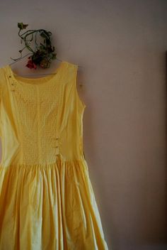 "Summer fashion vintage 60s, yellow cotton, hand made dress. Mod style. Sleeveless. Boat neck line. The front accented with a horizontal pin tack and 6 rhinestones buttons. Fully cinched under waist line. The metal zipper of the left side. Cute! Light, comfortable, unique. Gently used condition. Clean and strong. No any damage, no discoloration, no odor. Size 4. Length :40,0\" Shoulder:14,5\" Bust:34,0\" Waist:28,0\" Length of the arm hole across:7,5\" Sweep:84,0\" Thank you for stopping!" Yellow Fitted Sleeveless Cotton Dress, Fitted Sleeveless Yellow Cotton Dress, Vintage Cotton Sleeveless Dress, Yellow A-line Vintage Dress For Summer, Vintage Cotton Dress For Summer, Summer Cotton A-line Vintage Dress, Vintage Cotton Sleeveless Sundress, Vintage Fashion Cotton Dress With Buttons, Sleeveless Cotton Vintage Sundress