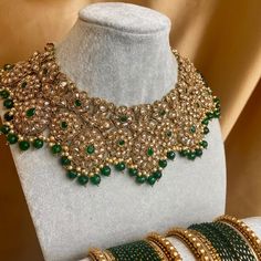 This is sold as necklace only  Stunning single statement necklace😍 Antique Gold base with sparkling champagne zircon crystals and emerald green detail✨ 3 inch length plus adjustable string! (Bangles sold separately) Ready to ship 📦Only one available! Green Jeweled Kundan Necklace For Party, Gold Emerald Jewelry For Parties, Hand-set Green Necklace For Party, Green Adjustable Jewelry Sets For Wedding, Adjustable Green Jewelry For Wedding, Adjustable Green Necklace For Wedding, Green Kundan Jeweled Necklace For Gifts, Hand Set Green Necklace For Party, Gold Bridal Necklace With Emeralds