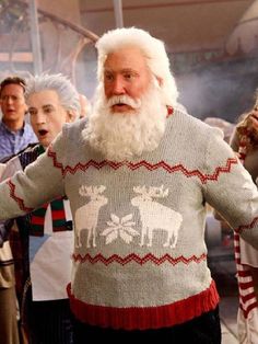 an old man with a long white beard wearing a ugly sweater