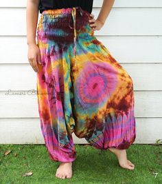 "💥One Size Fits Most Comfortable Low Cut Drop Crotch Tie Dye Harem Pants, Hippie Pants, Tie Dye Baggy Pants, Festival Harem Pants, Festival Clothing, Tye Dye Genie Pants, Tie Dye Comfy Pants 👉Fabric: Soft and Breathable Rayon 👉Smocked Elasticated Waist: 26\" up to 54\" 👉Hips up to: 60\" 👉Total Length: 39\" (Top to Bottom) 👉 Around elastic ankle 10\" 👉 Tie Dye Method 👉 One Size Fits M-XL or US 2-20 👉Extremely Comfortable 👉Boho/Hippie Theme, Beach Wear/Festival Going Pants Note: Due to t Pink Baggy Harem Pants For Summer, Hippie Relaxed Fit Harem Pants For Summer, Summer Hippie Relaxed Fit Harem Pants, Baggy Parachute Pants For Summer Festivals, Bohemian Baggy Parachute Pants For Summer, Summer Bohemian Baggy Parachute Pants, Pink Summer Harem Pants, Summer Hippie Harem Pants With Loose Fit, Cotton Hippie Parachute Pants For Summer