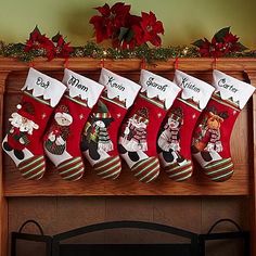 christmas stockings hanging on the mantle in front of a fire place