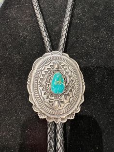 Gorgeous fine Navajo Sterling silver concho style bolo tie with a lovely piece of Fox turquoise, by Leonard Maloney, Dine' / Dineh, Native American Indian... Classic... Large... Sculptural, with complex silver work, including overlay, scalloped edges & oxidized patina.  Just beautiful!  Artist hallmark & sterling stamps on backside. " x " 722R - This stunning piece is coming from an exciting relationship with a well known & popular Santa Fe, NM, jewelry gallery. I will be listing many exquisite, even World Class, pieces, some at lower prices than they are offered at in the gallery. The owner is a certified Gemologist who has been dealing in fine jewelry from all over the world for almost a half century! Please see my other listings from this partnership mostly in my section titled "Fine Je Traditional Stamped Turquoise Jewelry, Western Style Engraved Blue Jewelry, Bohemian Silver Bolo Ties For Western-themed Events, Silver Bohemian Bolo Ties For Western-themed Events, Silver Bohemian Bolo Tie For Western-themed Events, Southwestern Engraved Jewelry For Western-themed Events, Artisan Turquoise Bolo Ties For Gifts, Artisan Oval Concho Jewelry, Western Oval Engraved Jewelry