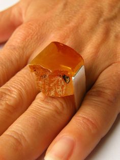 "RING  Handmade Baltic Amber, combined with a matt silver (925). Amber Size: approx.  0,89\" x 0,8\" Colour: orange yellow The circuit is an open ring, adjustable - beautiful and elegant - For customers outside European Union return or exchange is not possible." Modern Orange Sterling Silver Jewelry, Orange Hallmarked Ring As Gift, Modern Orange Rings For Gifts, Modern Orange Rings For Gift, Modern Orange Rings As Gifts, Orange Rectangular Jewelry As Gift, Handmade Orange Rings As Gift, Handmade Orange Rings For Gifts, Minimalist Orange Jewelry For Gifts