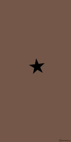 a black star on a brown background