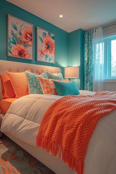 a bedroom with blue walls and orange accents