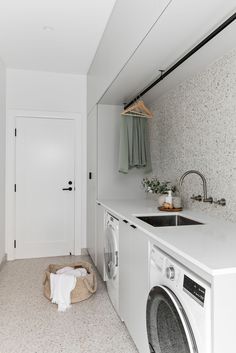 a laundry room with a washer and dryer