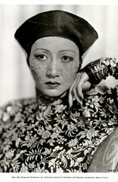 an old black and white photo of a woman with freckles on her face