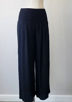 Discover the perfect combination of style and comfort with our Smocked Waist Wide Leg Linen Pants. Designed with a smocked waistband for a flattering fit, hidden side seam pockets for convenience, and a lined interior for added comfort. Made with a blend of rayon and linen, these pants are perfect for any occasion. Order now and elevate your wardrobe! Fit : True to size Flowy fit Xl can fit large Elastic Smocked Waistband Pockets Lined Linen Rayon Linen Pants Black, Animal Print Jeans, Wide Leg Linen Pants, Cardigan Sweater Jacket, Printed Jeans, Linen Pants, Pants Black, Black Media, Sweater Jacket