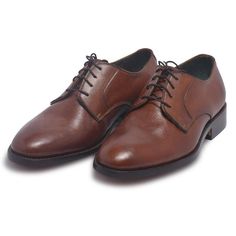 Upgrade your shoe collection with these brown derby genuine leather shoes from the LeatherSkinShop. The handmade design is crafted with care down to the details and comes in the neutral shade of brown to go with most of your dresses. Some of the noteworthy features of these brown derby genuine leather shoes include: The handmade design is crafted to maximize your foot comfort The pair of shoes bears laces with fine details to give you an elegant design The shoes are made with high-quality genuine leather These shoes come in the color brown to complement most of the pieces in your wardrobe Set your style a class apart with this elegant design that is a work of brilliance and finesse. Brown Goodyear Welted Lace-up Derby Shoes, Brown Goodyear Welted Oxford Lace-up Shoes, Brown Lace-up Derby Shoes For Business, Brown Goodyear Welted Almond Toe Oxfords, Brown Goodyear Welted Oxfords For Derby, Classic Brown Plain Toe Oxfords, Brown Goodyear Welted Lace-up Leather Shoes, Brown Goodyear Welted Lace-up Dress Shoes, Brown Cap Toe Goodyear Welted Lace-up Shoes