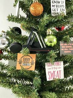 a christmas tree decorated with ornaments and sayings