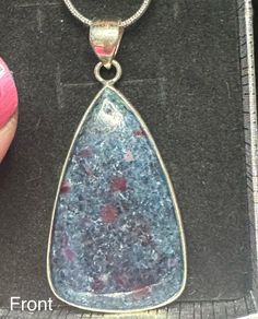 Looking for a way to elevate your jewelry collection? This exquisite pendant featuring Ruby in Kyanite, set in .925 Sterling Silver, is the perfect addition. Its measurements are Length 2", Width 1", Height .25" The Ruby element is believed to stimulate the heart chakra, promoting love, passion, and vitality, while also aiding in the manifestation of one's desires and protecting against negative energies. Sterling Silver Teardrop Pendant For Jewelry Making, 925 Stamped Drop Jewelry For Anniversary, Spiritual Teardrop Jewelry For Formal Occasions, Hallmarked Pear-shaped Sterling Silver Jewelry, Formal Spiritual Teardrop Jewelry, Sterling Silver Drop Jewelry Hallmarked, Pear-shaped Silver Gemstone Jewelry, Sterling Silver Drop Jewelry With Natural Stones, Anniversary Jewelry With Natural Stones In Teardrop Pendant