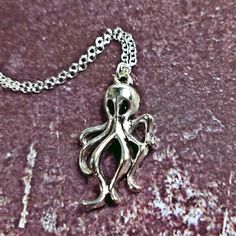 Cute Dainty Octopus Necklace. Materials: Silver Metal Alloy Sizes: Chain Is 20" W/ Lobster Clasp . Pendant Is .75" X 1" ~~ Boho Bohemian Gothic Hippy Trendy Gift Steampunk Gothic Arthropod Squid Sea Water Ocean Marine Alien Tentacles ~~~~ My Closet Offers 25% Off 2+ Items. Alien Tentacles, Blue Gothic Metal Necklace, Alien Jewelry, Ocean Accessories, Squid Jewelry, Silver Gothic Chain Necklace With Lobster Clasp, Tentacle Necklace, Gothic Hippie, Gothic Mermaid Necklace