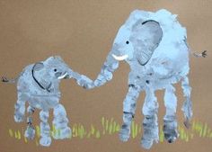 a child's drawing of an elephant and baby elephant on brown paper with grass