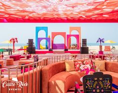 Our beach party setup was a vibrant spectacle of majestic structures and quirky shapes, all brought to life in the most striking colors. Beach Stage Design, Beach Setup, Stage Backdrops, Indoor Beach, Events Decorations, Mehendi Decor Ideas, Mehendi Decor, Stage Decor, Party Setup