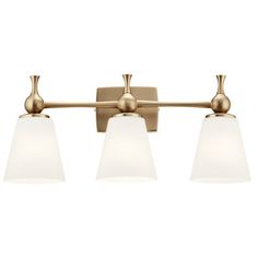 three light bathroom fixture in an antique brass finish with frosted glass shades on the sides