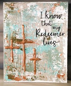 a painting with three crosses on it that says i know that my redeem lives