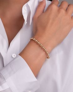 Fun and chic 14k gold 3mm and 5mm bead bracelet in a stretch fit, wear it up or down by itself or stacked with your other fine and fashion bracelets for the perfect arm party. Made in L.A. Stretch Fit 14k gold hollow beads Ships in 3-6 business days Rush orders ship in 2-4 business days Comes gift ready in a beautiful jewelry box Rose Gold Beaded Bracelets With 8mm Beads, Elegant Gold Flexible Stretch Bracelet, Elegant Flexible Gold Stretch Bracelet, Elegant Stretch Bracelet With 8mm Beads For Party, Elegant 8mm Beads Stretch Bracelet For Party, Rose Gold Hand-strung Bracelets, Flexible Hand-strung Bracelets, Elegant Rose Gold Beaded Bracelets With 8mm Beads, Minimalist 8mm Beads Bracelet