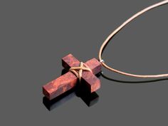 Amboyna Cross Necklace. This cross necklace was made from amboyna burl wood, polished and finished with fine tung oil. This boho style wood cross can be perfect gift for man or gift for woman. CROSS GALLERY : https://www.etsy.com/shop/NikibarsNatureArt?section_id=16787849&ref=shopsection_leftnav_5 Cross height - 1 7/16 inches (37 mm) The length of the cord is about 30 inches (77 cm), but it can be regulated by the movable knot. Materials utilised: amboyna, waxed cord Production method 100% h Brown Cross Pendant Necklace As Gift, Brown Cross Pendant Necklace For Gift, Amboyna Burl, Boho Cross, Mens Cross Necklace, Bone Horn, Gold Cross Necklace, Wood Crosses, Wood Resin