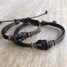 "These lovely bracelets are made with waxed cord, brown rubber spacers, and sterling silver links. Designed for couples If you choose \"Custom Initials Set\" Please leave me a note at checkout with the initials. Both bracelets are adjustable. One closes to 6\" and opens to 9\", the other closes around 7\" and opens to 10\". Includes Gift Box if you choose the set option in the dropdown menu." Personalized Adjustable Beaded Bracelets For Promise, Couples Promise Bracelet Jewelry, Adjustable Couples Promise Jewelry, Adjustable Couples Jewelry For Promise, Brown Resizable Jewelry For Gifts, Adjustable Cord Round Friendship Bracelets, Adjustable Cord Round Friendship Bracelet, Adjustable Cord Round Bracelet For Friendship, Brown Adjustable Band Bracelet Jewelry