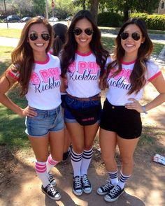 three girls are posing for the camera wearing matching shirts and shorts that read pink ribbon rockin '