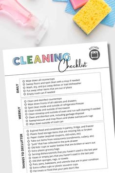 the cleaning checklist is shown on top of a white table with pink and blue sponges