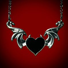 Devil’s heart necklace is the perfect spooky accessory to wear if you love to glamour your dark side! Pair this with our sterling silver bat wing ring to make the perfect accessory combo! material: zinc alloy 20” chain Gothic Winged Jewelry Gift, Gothic Winged Jewelry For Gifts, Edgy Halloween Necklace Gift, Edgy Necklace For Halloween Gift, Emo Jewelry With Adjustable Chain For Parties, Halloween Heart-shaped Metal Jewelry, Heart-shaped Metal Jewelry For Halloween, Silver Emo Jewelry For Halloween, Gothic Metal Heart Necklace