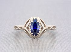 Sterling silver Celtic knot marquise blue sapphire engagement ring  Fusion blue sapphire size 10x5mm approx. marquise shape brilliant excellent cut solid sterling silver sapphire ring for women The ring dimensions are: front width: 12 mm/ 0.47" inch front height above the finger: 4.5mm/0.17" inch approx. side thickness: 1.7mm/0.06" inch side width: 3mm/0.11"inch back thickness: 1.4mm/0.05" inch back width: 2.4mm / 0.09" inch approx.   💎 OUR SHOP💎  https://www.etsy.com/shop/ClanTora 💍 RING 💍 Promise Ring Sapphire, Silver Celtic Rings, Celtic Ring, Saphir Ring, Ring Sapphire, Celtic Rings, Blue Sapphire Ring, Sapphire Engagement Ring Blue, Blue Sapphire Rings