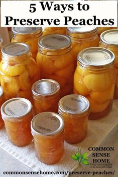 several jars filled with pickles sitting on top of a white cloth covered tablecloth