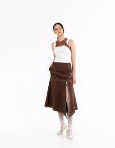 This midi skirt features a low rise and is made of lightweight denim that flares out at the bottom. It has a back zipper and button closure, and the pockets add convenience.Product measurements:Size XS: waist 72 cm / 28,4 in, hips 95 cm / 37,4 inSize S: waist 76 cm / 30 in, hips 99 cm / 39 inSize M: waist 80 cm / 31,5 in, hips 104 cm / 41 inSize ML: waist 84 cm / 33 in, hips 109 cm / 43 inLength from waist to bottom front: 89 cm / 35 inSide length: 78 cm / 30,7 inModel: height 178 cm / 70 in; bust: 88 cm / 34,7 in; waist: 63 cm / 24,8 in; hips: 93 cm / 36,6 in; wearing size: SSeason: Spring/Summer/AutumnComposition: 100% cottonCare instructions:Machine wash at 30°C. Spin at 600-800 rpm.Do not tumble dry.Do not use chlorine bleach or stain removers.Iron at high temperature.It is recommended Fitted Brown Cotton Denim Skirt, Fitted Brown Cotton Skirt, Brown Cotton Flared Skirt, Brown Denim Skirt, Stain Removers, Brown Denim, Fast Fashion, High Temperature, Fabric Color