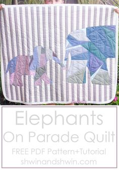 a child holding up a quilt that has elephants on it and the words elephant on parade quilt